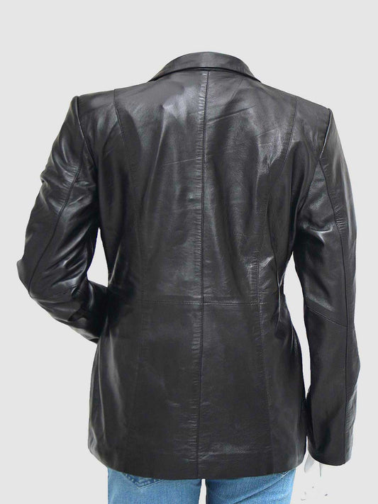 Close-up of a tailored black leather car coat for women, showcasing the notched collar and two black buttons visible on the front placket.