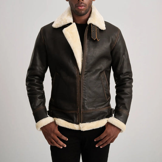 Back view of a man wearing a brown sheepskin leather jacket with thick white shearling visible at the collar, cuffs, and hem, highlighting the quality of the material.