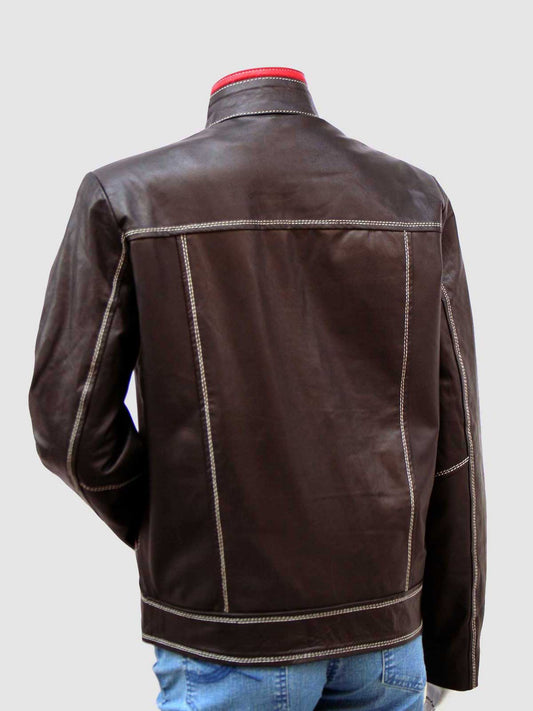 Close-up of a women's leather jacket in dark brown, featuring red trim on the collar and chest, and highly visible white stitching throughout.