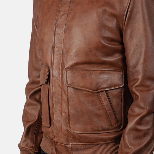 Front view of a brown sheepskin leather jacket, featuring a wide brown fur collar, exposed shearling trim, and an asymmetrical zip closure.