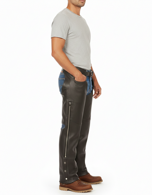 Close-up of the long vertical side zipper and silver metallic ankle hardware on professional black leather chaps.