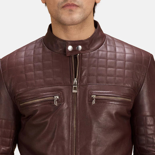 Brown leather jacket with quilted design and zippers on a neutral background