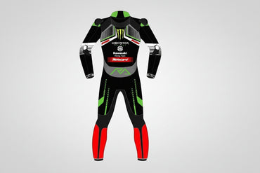 Detailed view of the Monster Energy claw logo, Kawasaki Racing Team chest branding, and red racing leg panels on a professional suit.
