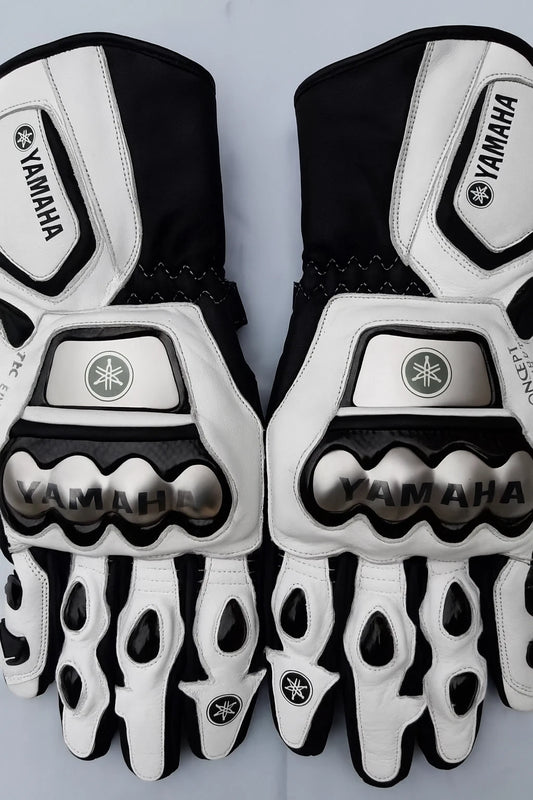 Yamaha leather motorcycle racing gloves in white and black with metallic knuckle armor.