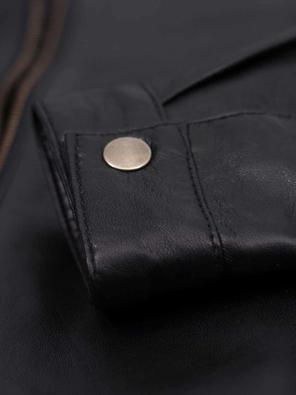 Tailored black leather jacket with quilted shoulders, offering a flattering fit and authentic biker style.