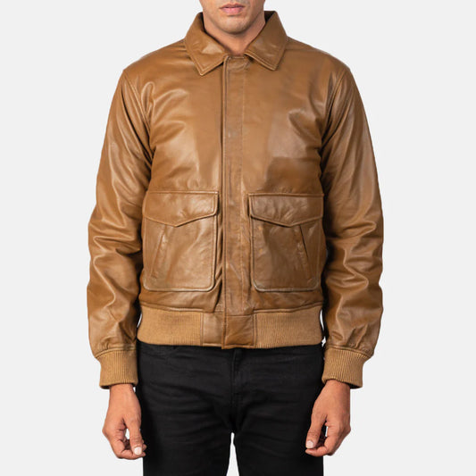 Front view of a smooth tan leather jacket on a man, showcasing the pointed shirt collar, zippered front, and ribbed waist hem.