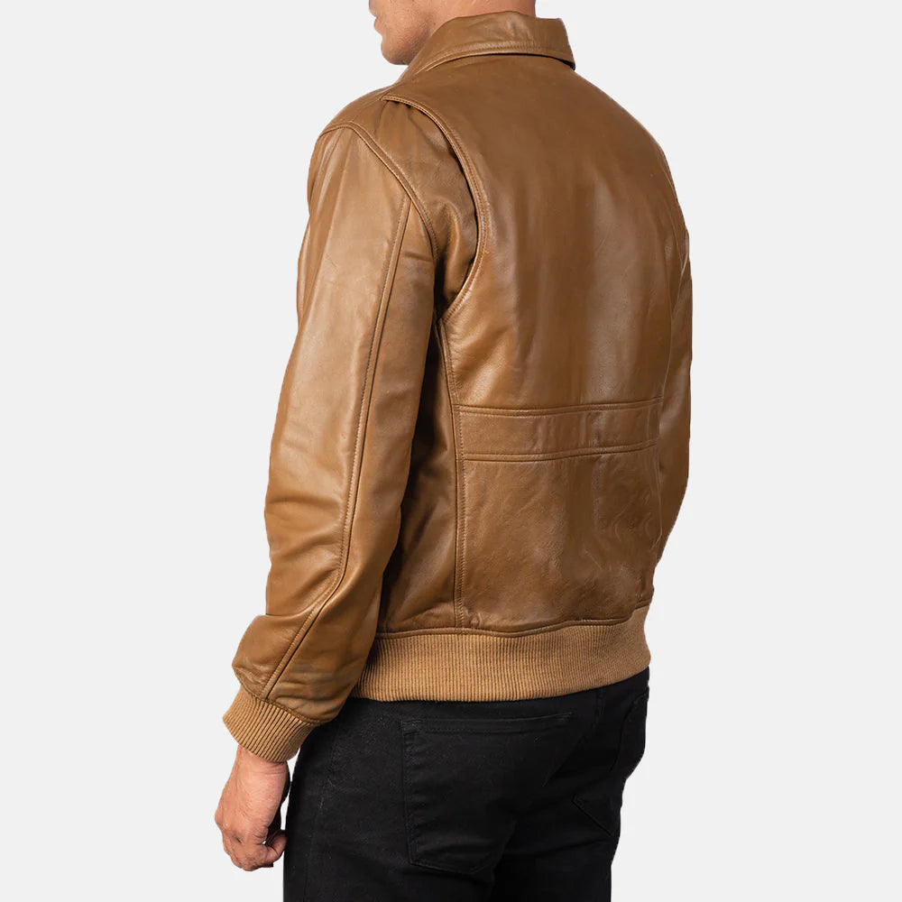 Light brown leather jacket with large flap pockets and a classic pointed collar.
