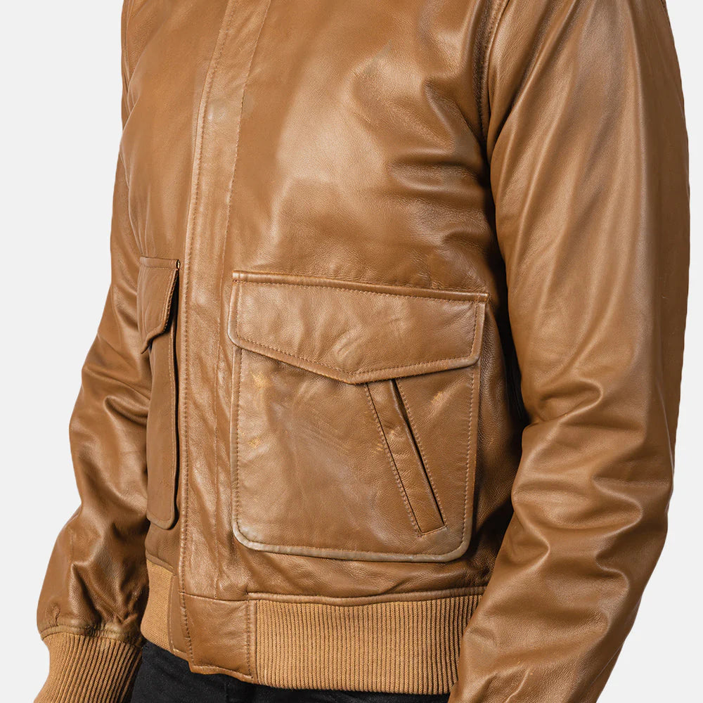 Tan leather A-2 jacket. Flight style, shirt collar, patch pockets, ribbed hem.