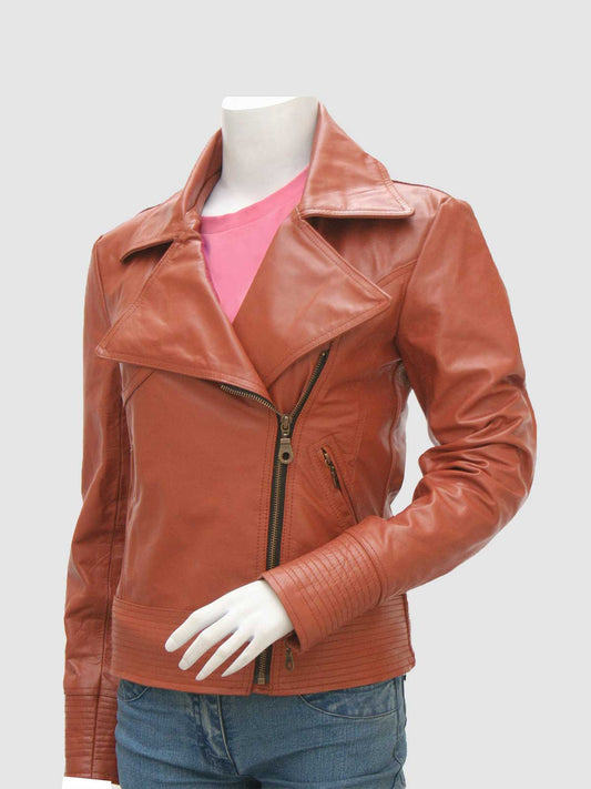 Front view of a warm brown leather biker jacket for women, showing the asymmetrical zip, wide collar, and ribbed detailing on the cuffs and waist.