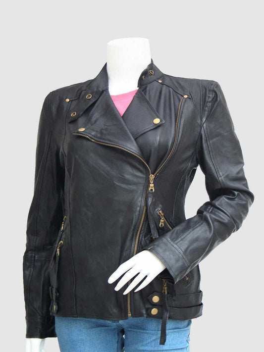 Front view of a black leather motorcycle jacket for women, showing the prominent brass zippers, snaps on the collar, and waist adjusters.
