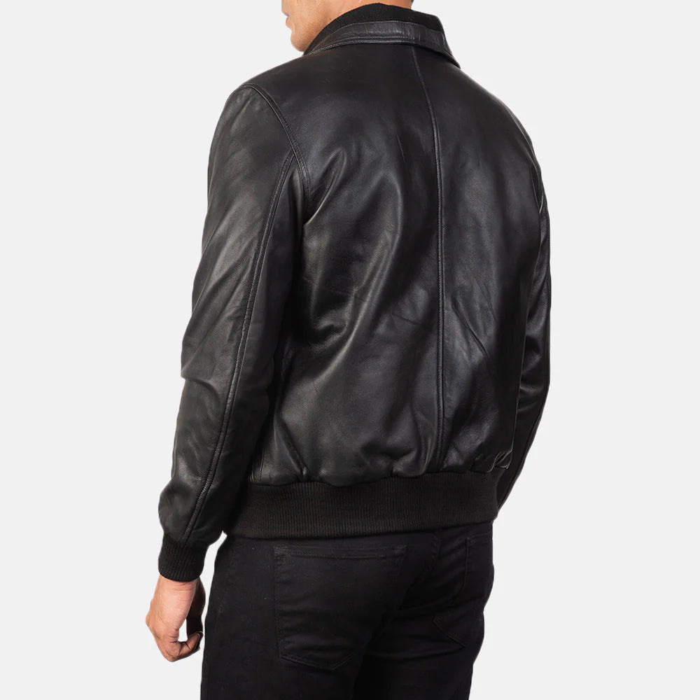 Black leather bomber. Aviator style, utility pocket, ribbed cuffs, band collar.