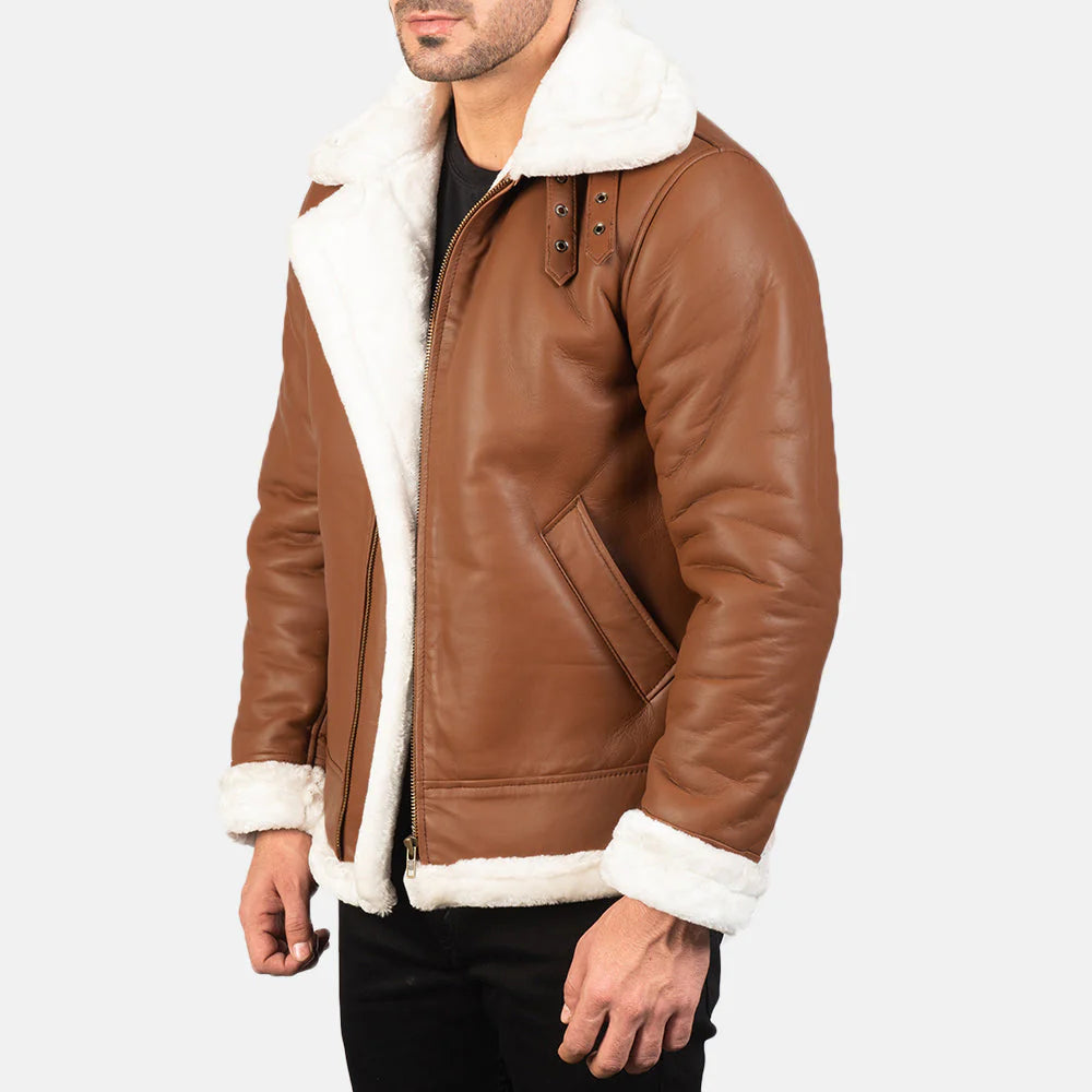 Front view of a brown sheepskin leather jacket on a man, showcasing the thick white shearling lining and large buckled aviator collar.
