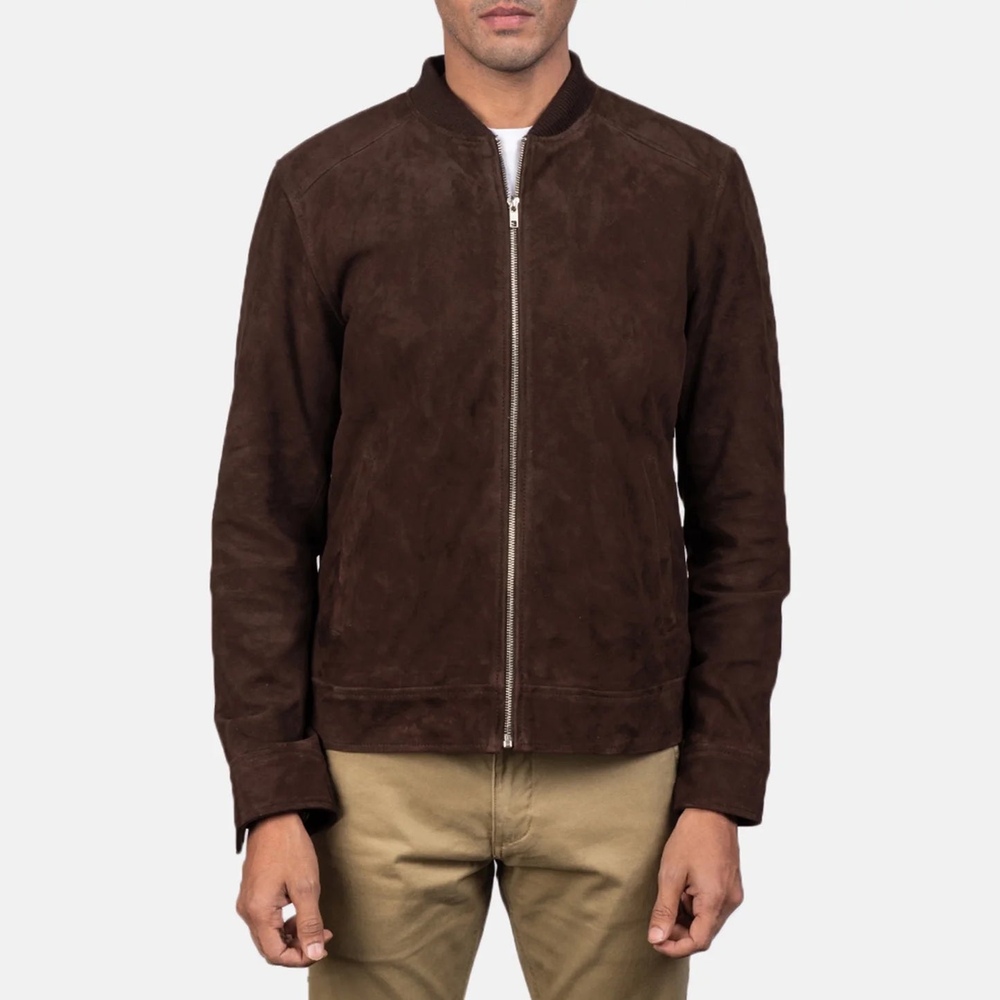Front view of a man modeling a dark brown suede bomber jacket, showcasing the soft matte texture and ribbed cuffs and hem.
