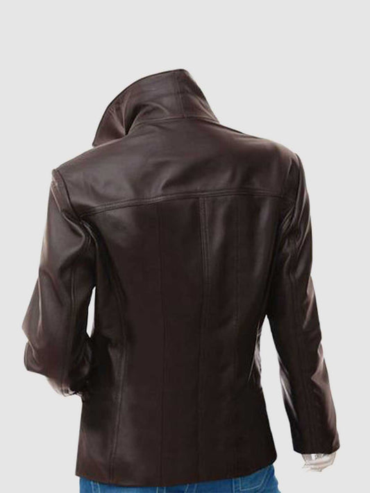 Close-up of a tailored brown leather blazer for women, showcasing the notched collar and rounded flap pockets on the lower front.