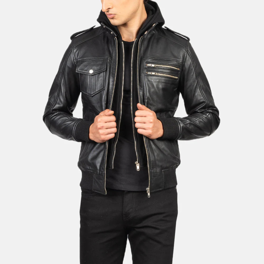 Front view of a man modeling an open tan/cognac leather jacket, highlighting the four flap pockets and high-neck snap collar.