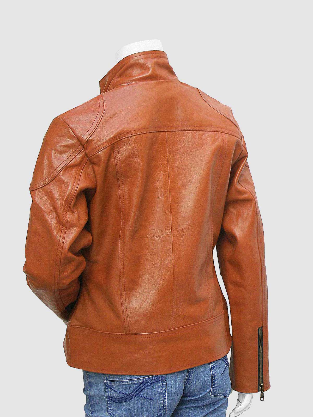 Close-up of a tailored brown leather blazer for women, showcasing the notched collar and rounded flap pockets on the lower front.