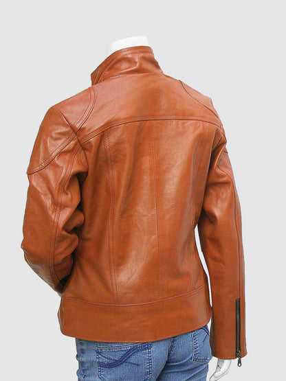 Close-up of a tailored brown leather blazer for women, showcasing the notched collar and rounded flap pockets on the lower front.
