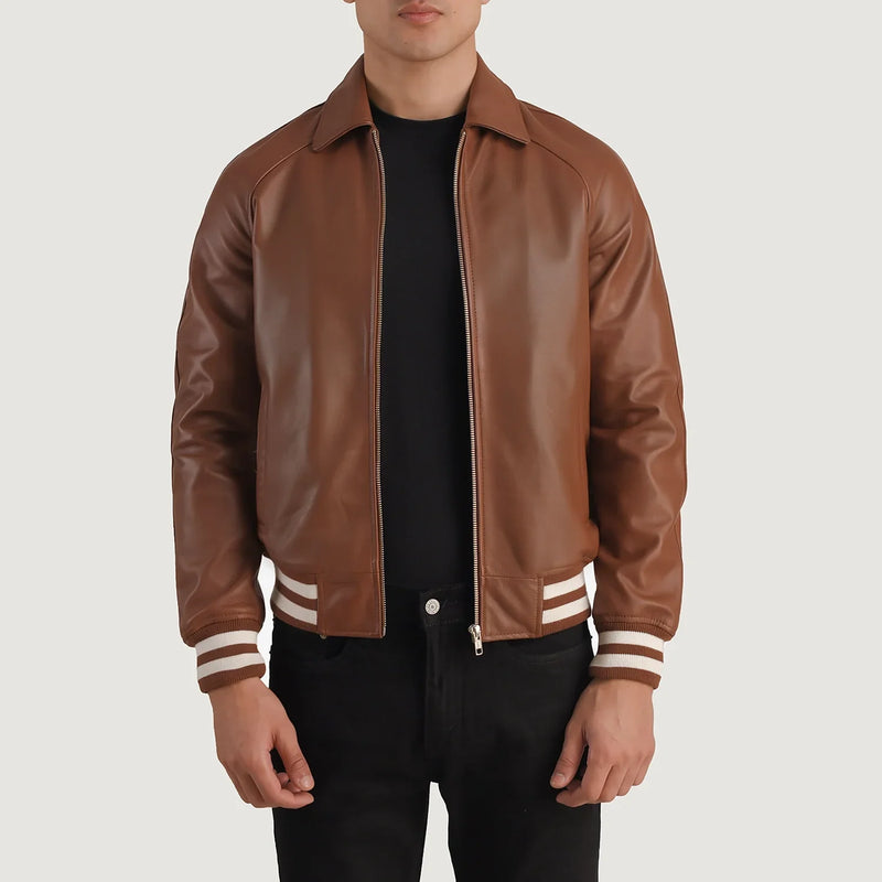 Men's Varsity Brown Leather Bomber Jacket with striped knit cuffs and hem and a shirt collar.