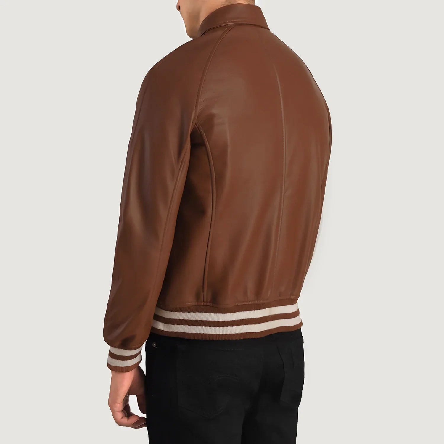 Hybrid brown leather jacket blending a classic shirt collar with athletic striped ribbing on the waist and cuffs.