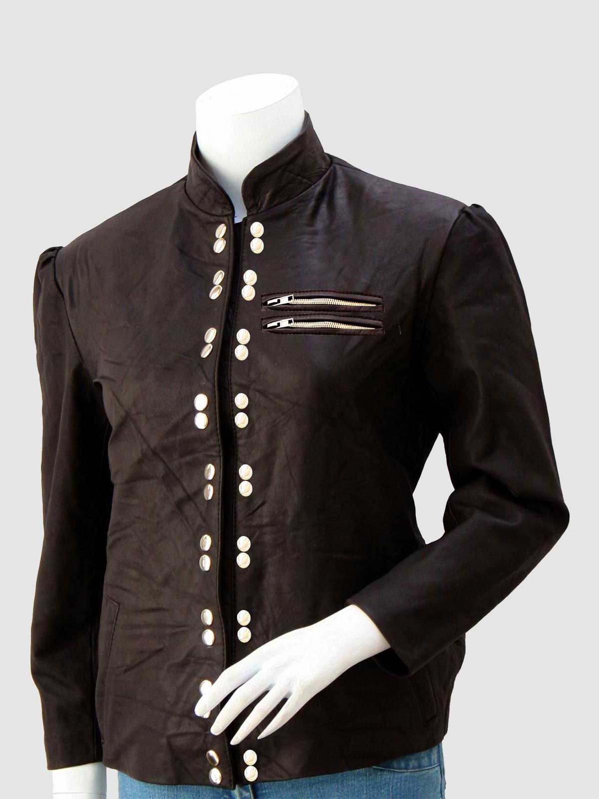 Front view of a tailored cognac brown leather jacket for women, showcasing multiple vertical brass-tone buttons and flap pockets with snap closures.