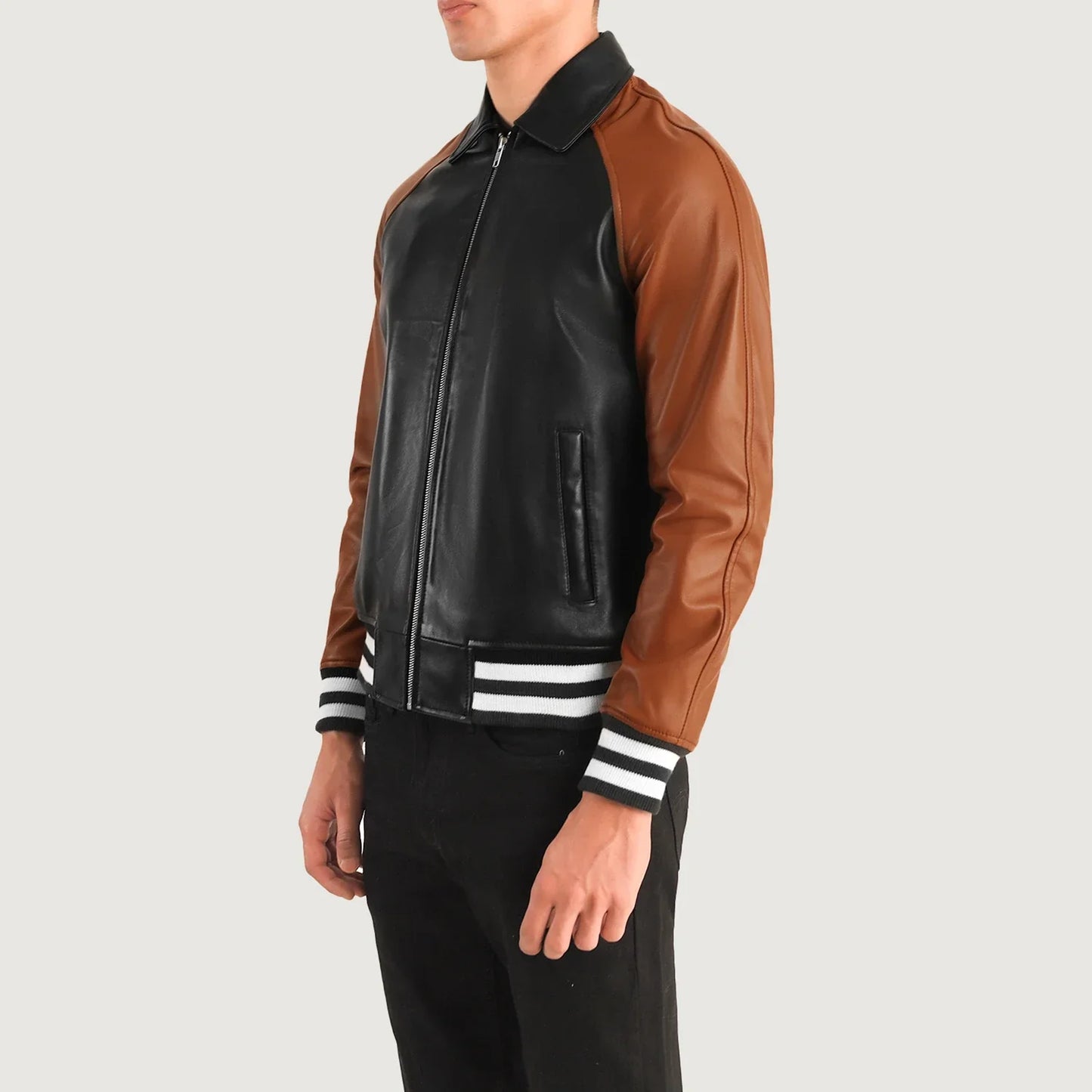 Bold two-tone leather varsity jacket for men, offering a unique color block design and comfortable athletic striped ribbing.