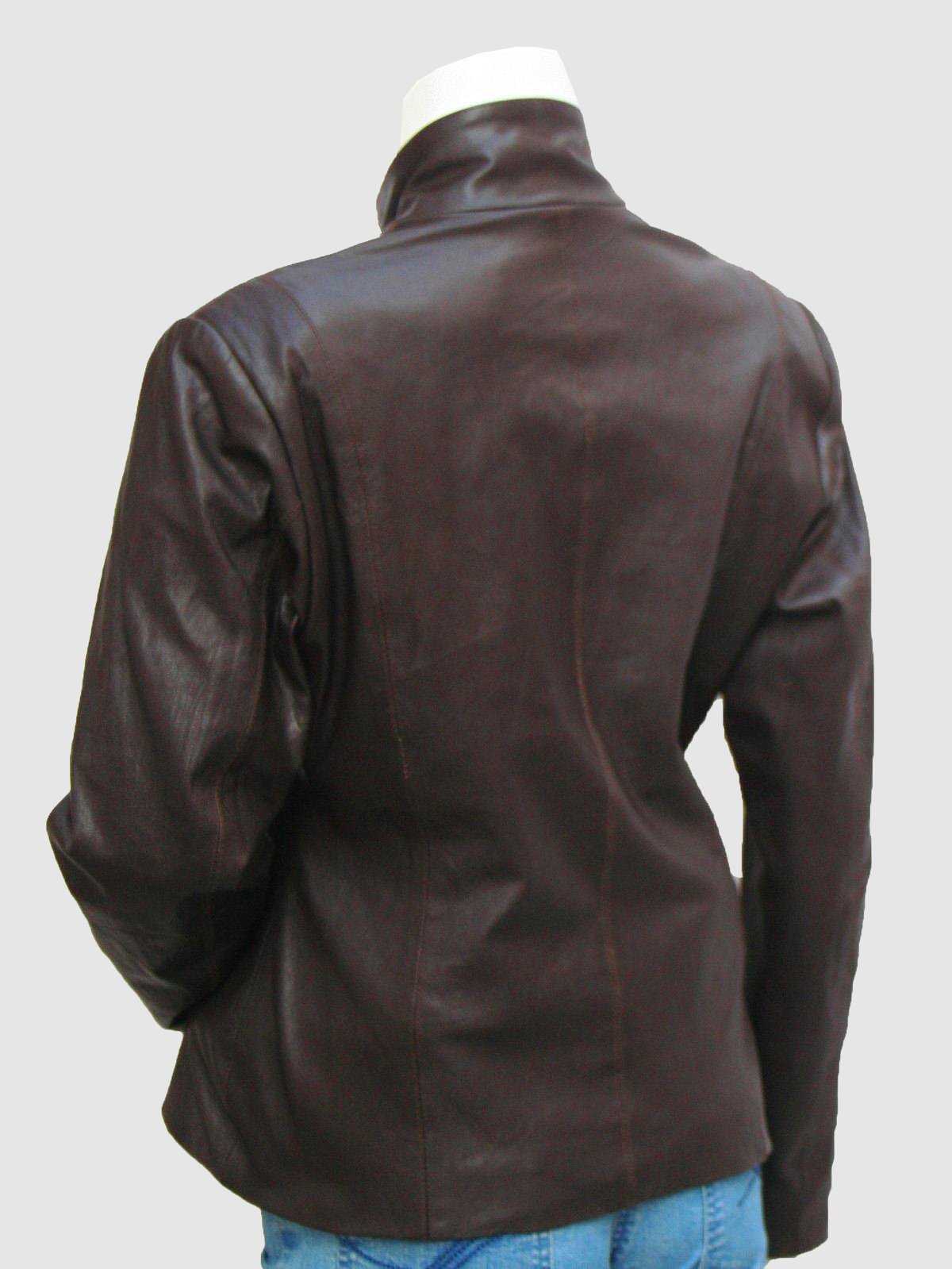 Close-up of a tailored black leather jacket for women, featuring a button-front placket and two horizontal silver zip pockets on the chest.