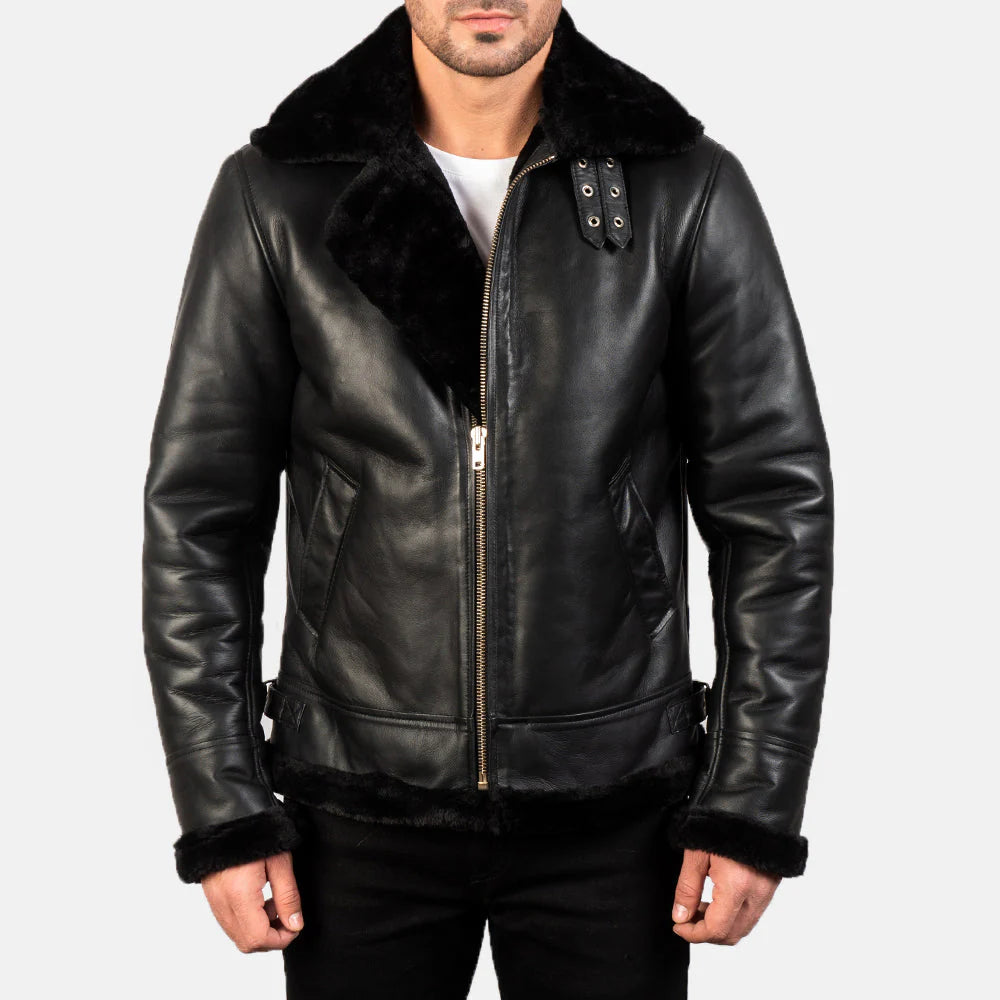 Front view of a man modeling a black leather double rider jacket, showing the pyramid studs on the shoulders and lapels.