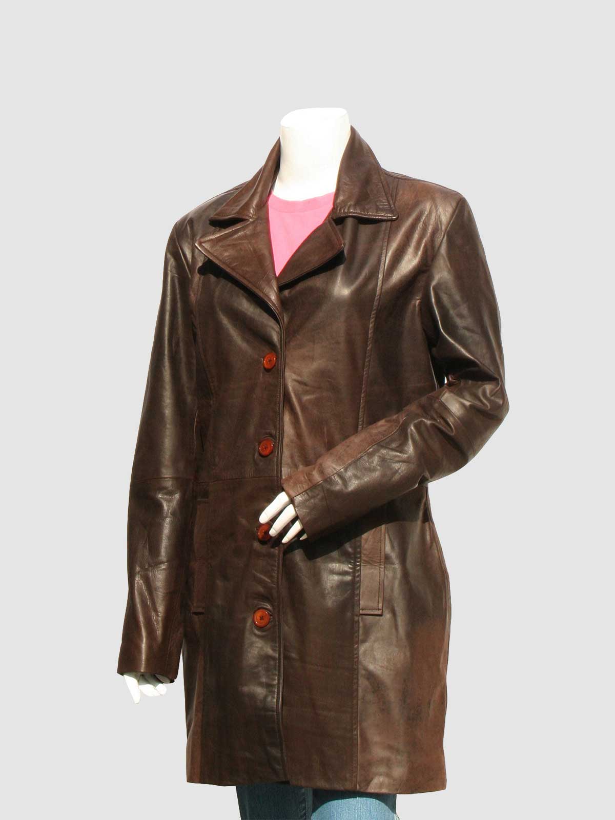 Front view of a longer-length dark brown leather coat, secured with three large buttons, featuring a simple collar and tailored panels.