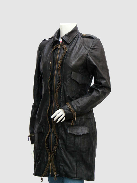 Front view of a black leather duster coat featuring a zipper cluster closure, collar, shoulder epaulets, and four patch/flap pockets.