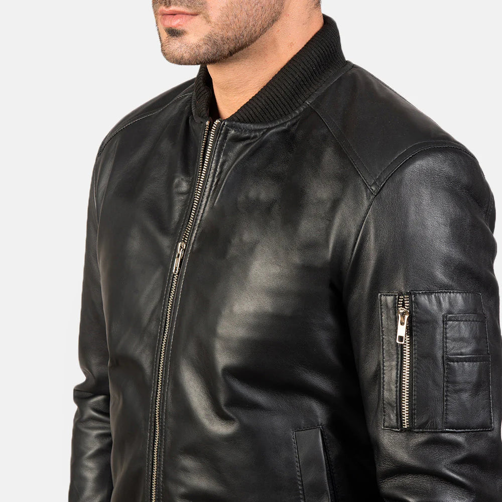 Black leather bomber. Aviator style, utility pocket, ribbed cuffs, band collar.