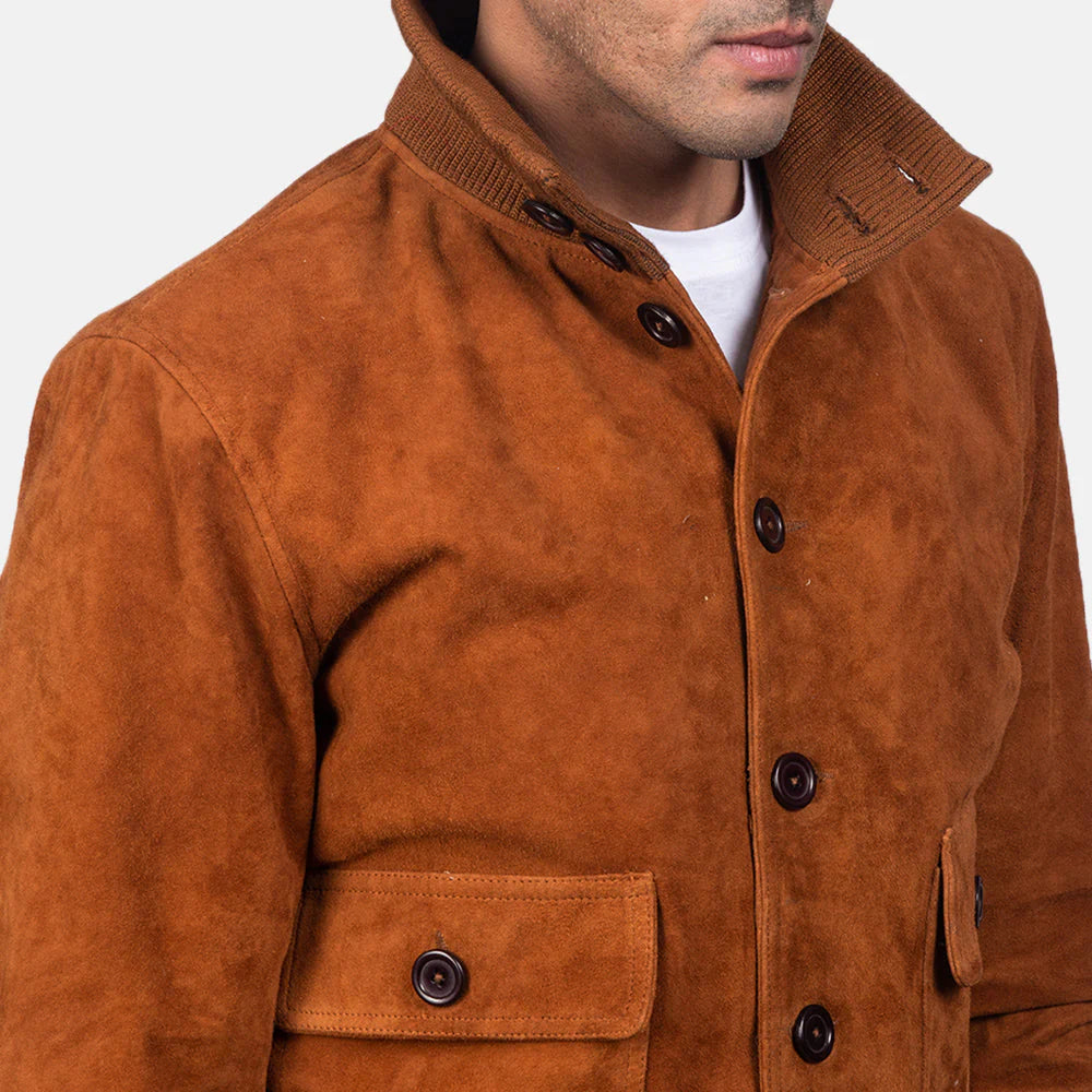 Front view of a man modeling a brown leather aviator jacket, showing the folded shirt collar, zippered front, and ribbed waist hem.