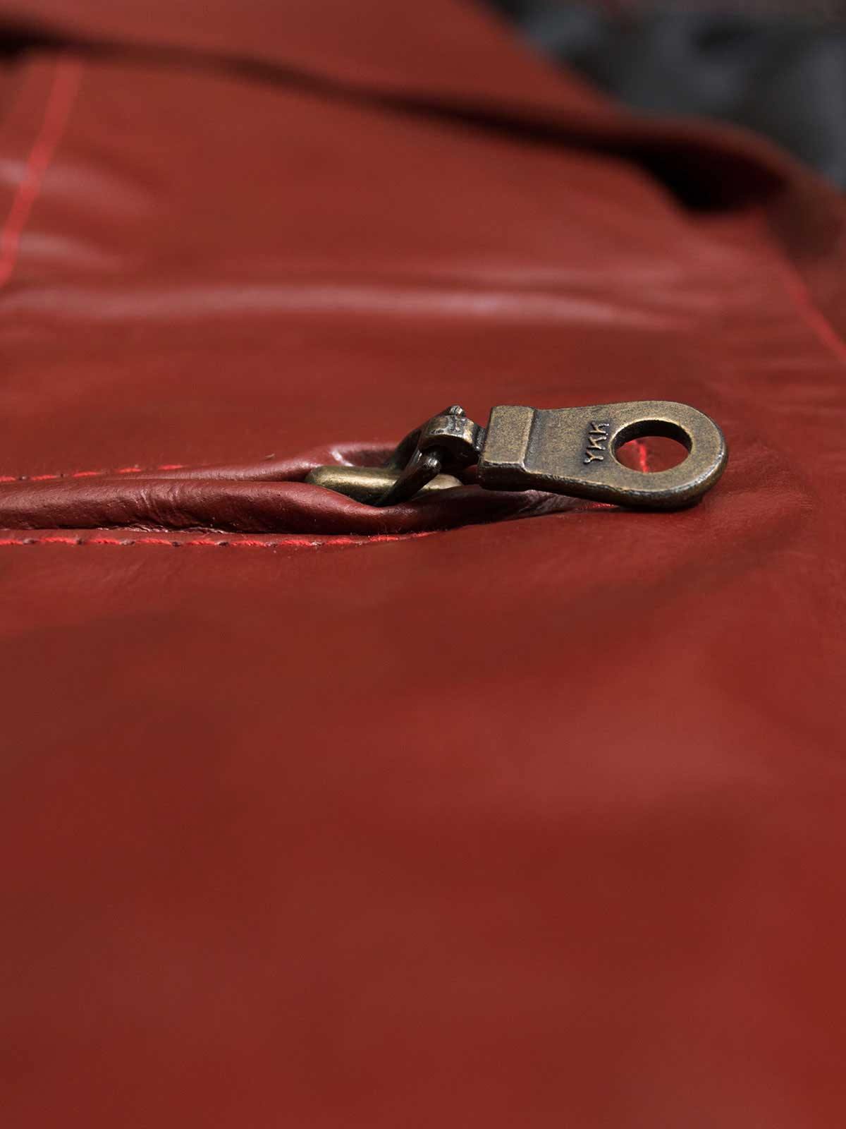 Bold red leather jacket for women, offering a flattering tailored fit and a classic zippered front for everyday chic.