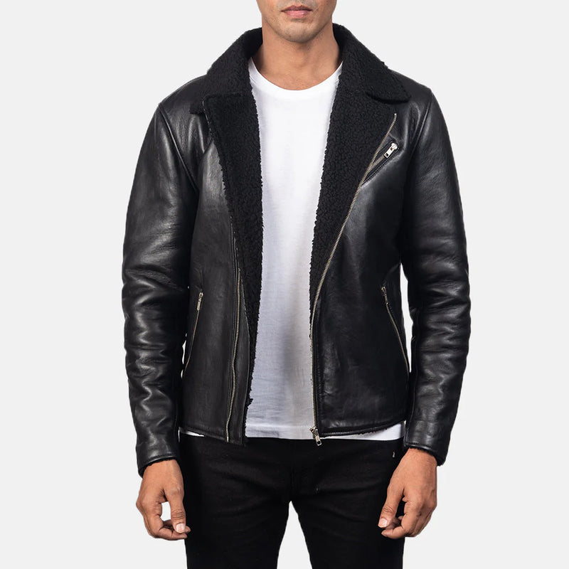 Men's black leather shearling jacket with a white t-shirt and dark pants. Product shot of a real sheepskin biker jacket with sherpa fur lining.