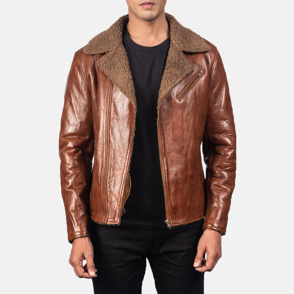 Men's distressed brown shearling leather jacket with a black t-shirt and dark pants. Real sheepskin biker jacket with warm sherpa fur lining.