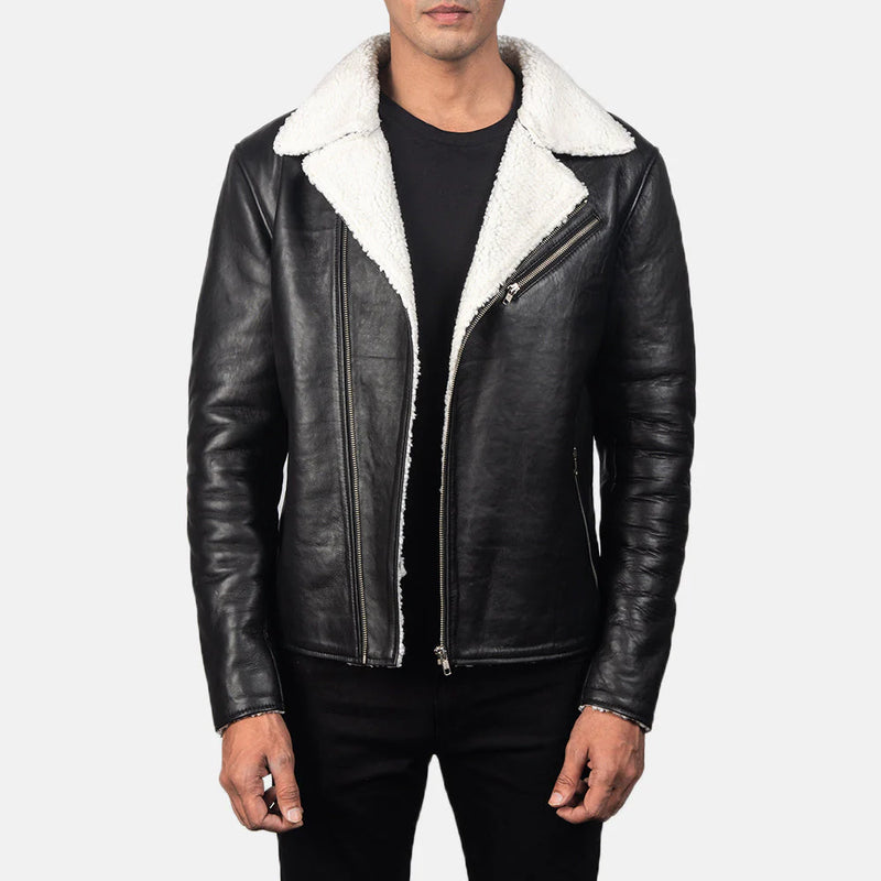 Men's black leather jacket with white shearling lining, worn with a black t-shirt. A real sheepskin biker jacket perfect for winter."