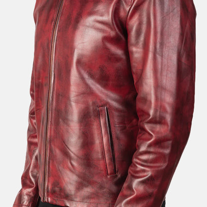 Front view of a man modeling an open burgundy leather jacket with a stand collar, showing the distressed texture and rich red-brown coloring.