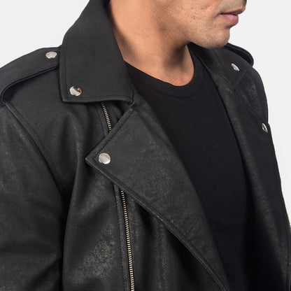 Front view of a man wearing an open black leather jacket with wide lapels, multiple silver zippers, shoulder epaulets, and a waist belt detail.