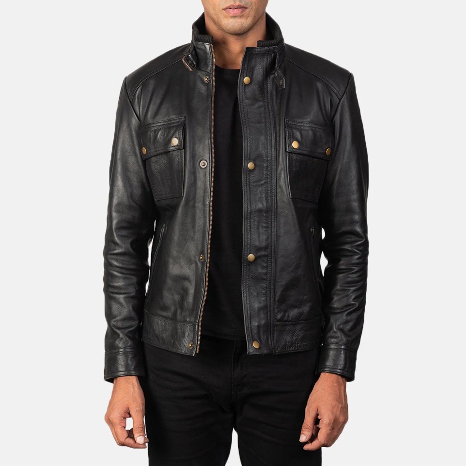 Front view of a man modeling a black leather jacket featuring two flap chest pockets, a snap-button front placket, and a buckle-fastening stand collar.