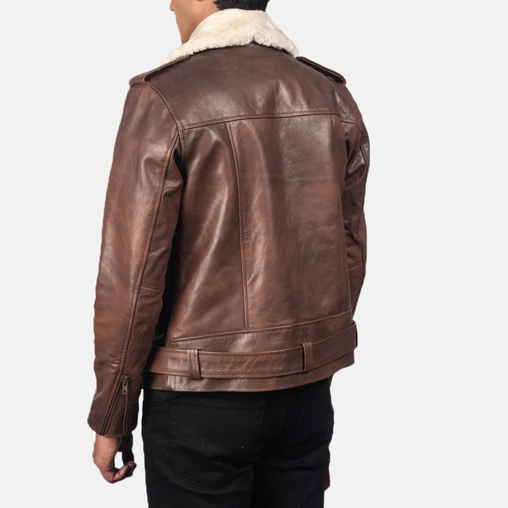 Rich brown leather jacket with a white fur collar, showing the asymmetrical zipper closure and contrasting textures.