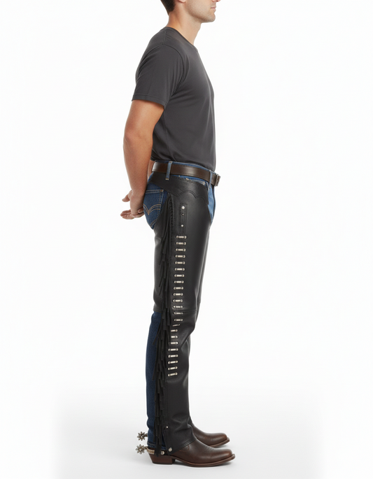Close-up of the smooth black leather texture, decorative silver hardware, and traditional side fringe on riding chaps.
