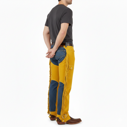 Male model wearing bright yellow suede protective fringe chaps over blue jeans for a modern western look.
