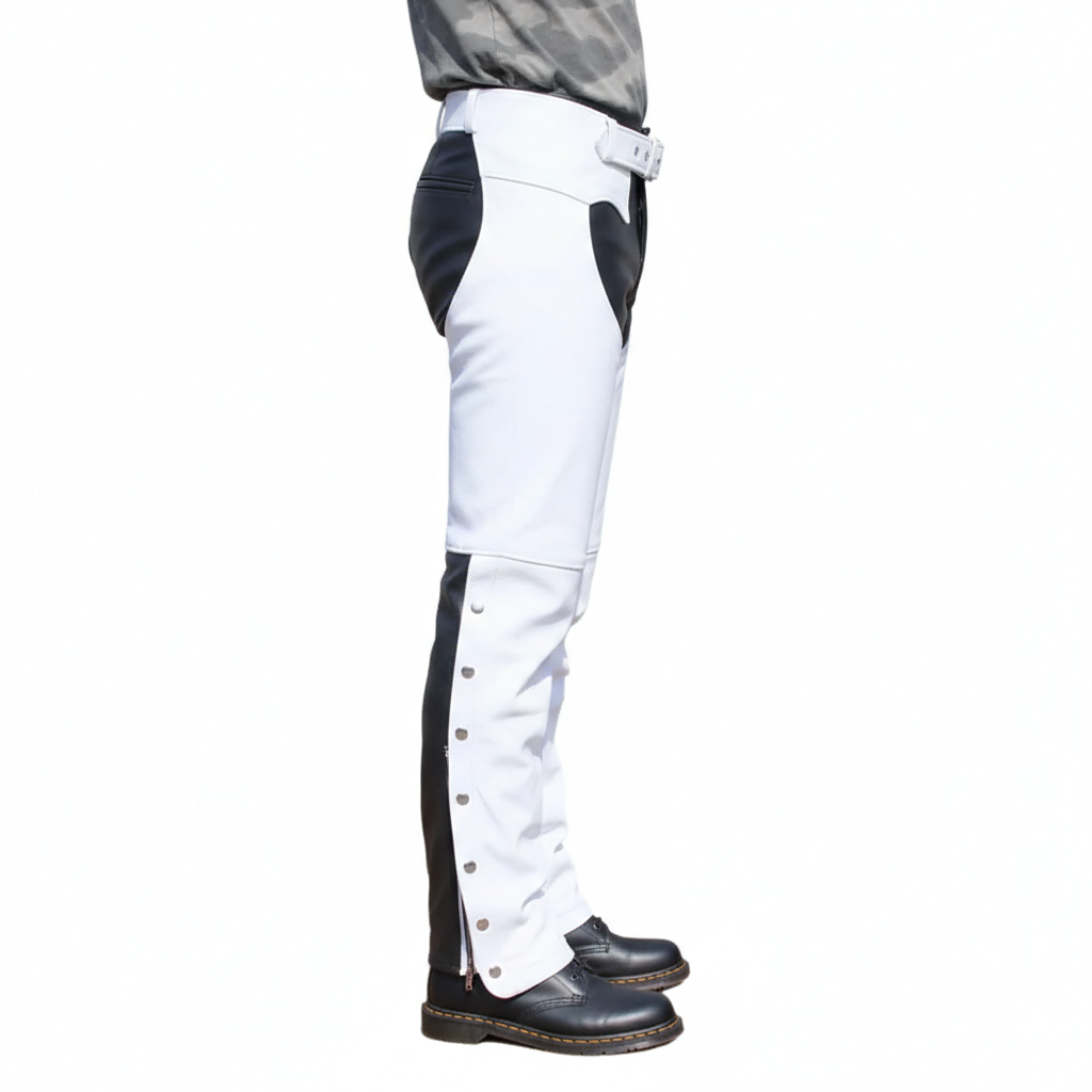 Close-up of the silver ankle snaps and articulated knee seaming on white and black leather biker overpants.