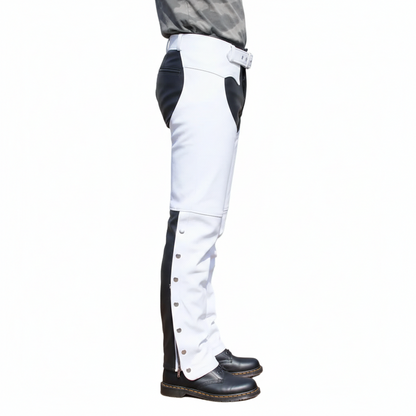 Close-up of the silver ankle snaps and articulated knee seaming on white and black leather biker overpants.