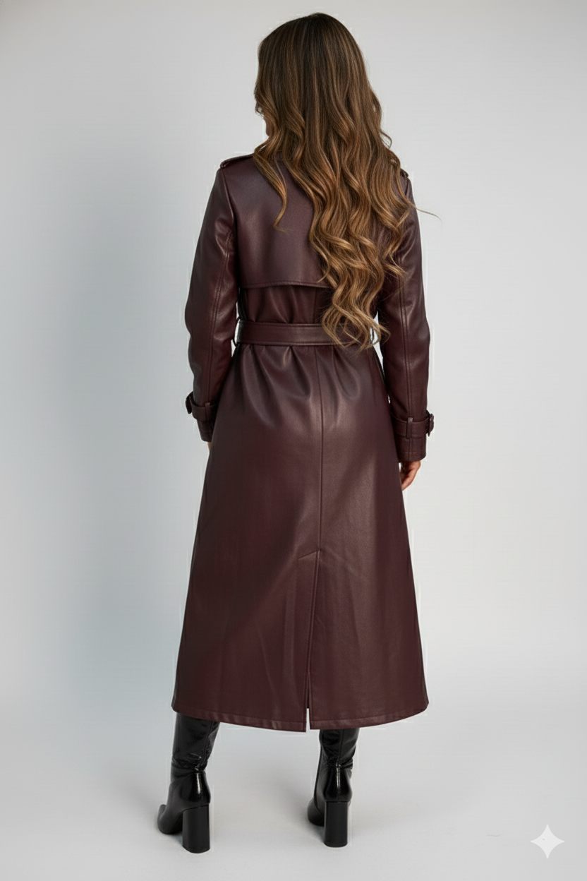 Fashionable midi-length brown leather coat for women, styled with a black turtleneck for a sophisticated modern look.