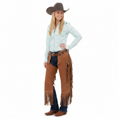 Women's sierra tan suede western chaps with a scalloped leather yoke, tiered side fringe, and silver hardware.