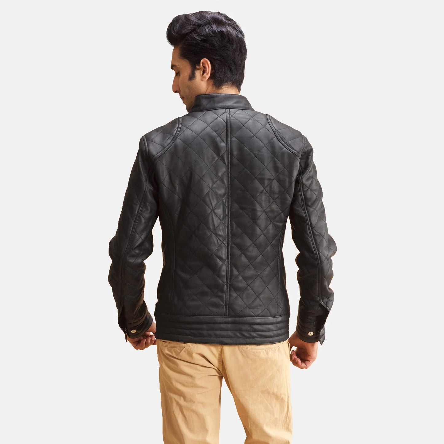 Black quilted leather jacket for men. Diamond pattern, snap collar, full zip.