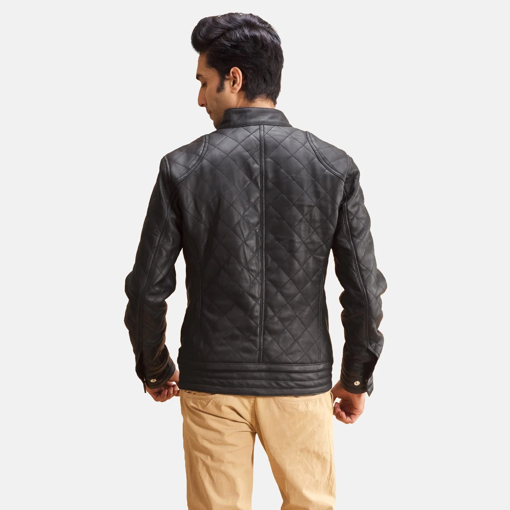Black quilted leather jacket for men. Diamond pattern, snap collar, full zip.