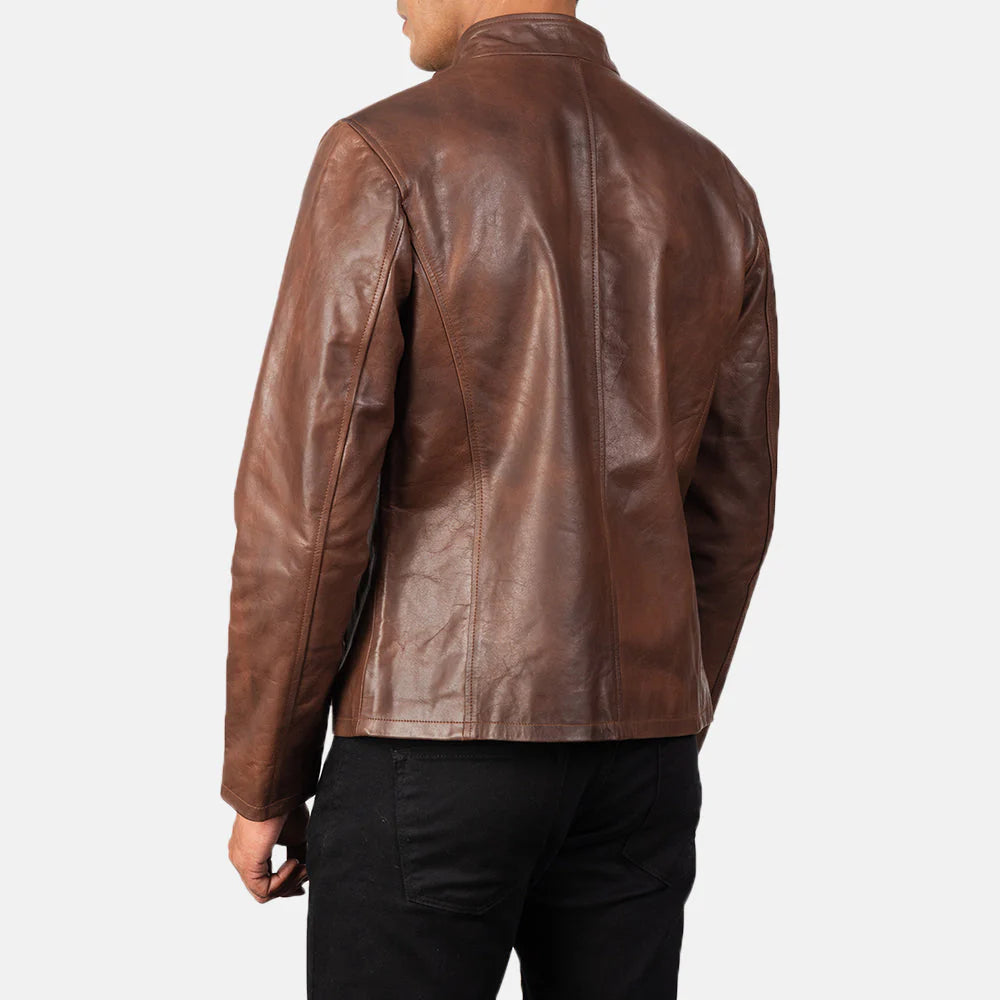 Rich brown leather jacket with a smooth finish, featuring a structured band collar and simple silver-tone zipper.