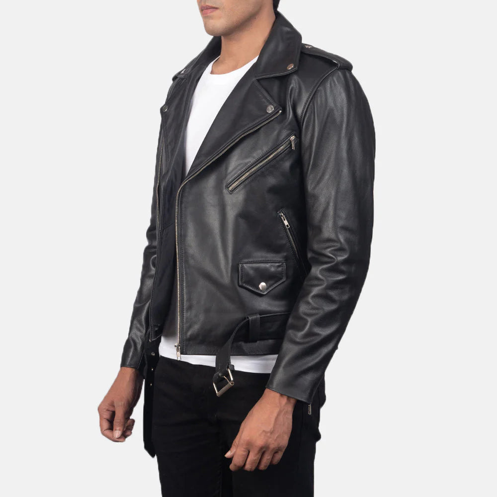 Front view of a man modeling an open, smooth black leather motorcycle jacket, showing the waist belt, silver hardware, and white t-shirt underneath.
