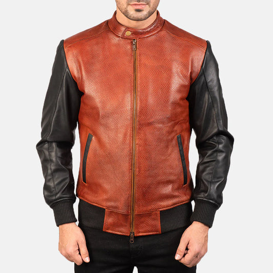 Front view of a man modeling an open two-tone leather bomber, showing the textured red body, black sleeves, and ribbed cuffs.